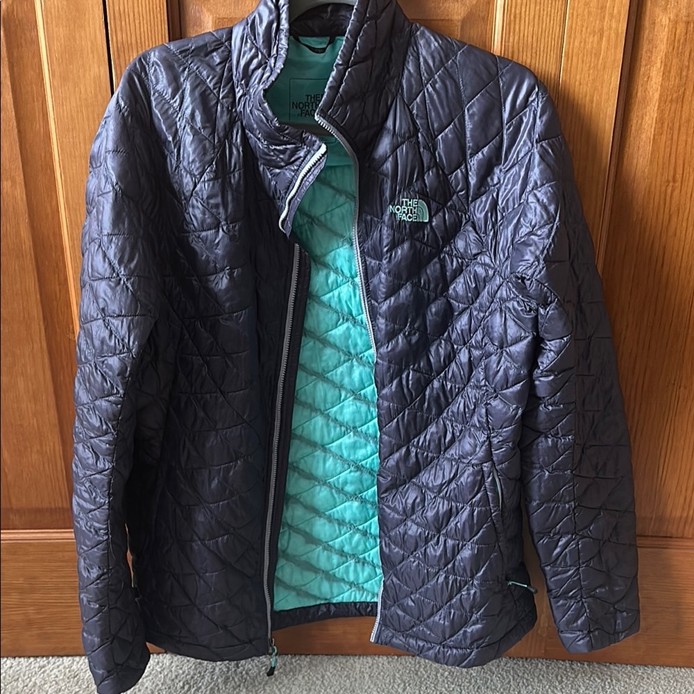 The North Face Quilted Jacket - Dark purple and Light Blue/teal. Gently used.